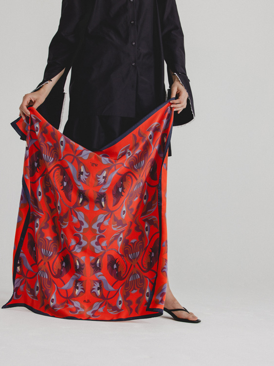 person showing silk scarf with eyes 