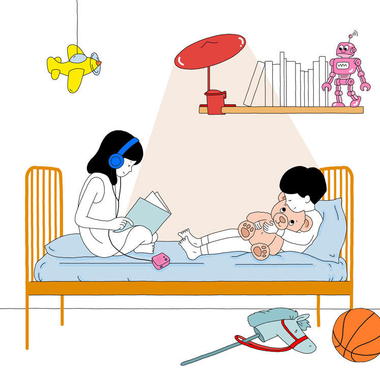 boy and girl reading in bed 