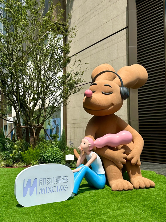 sculpture of young woman and giant dog 