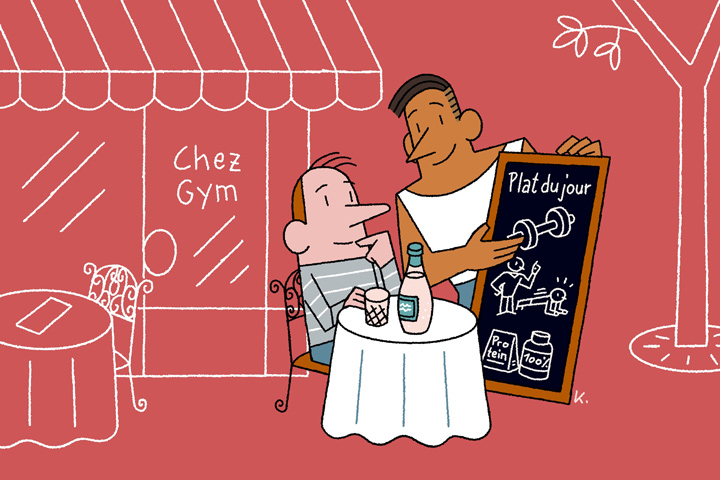 man in front of parisian cafe