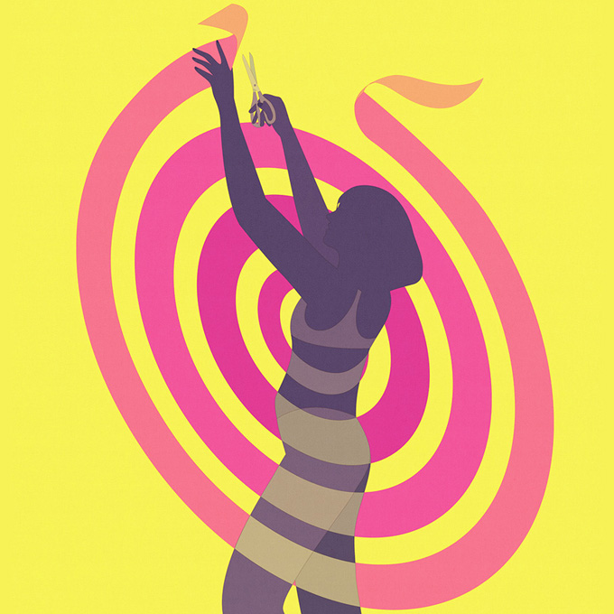 woman cuts a spiral ribbon 
