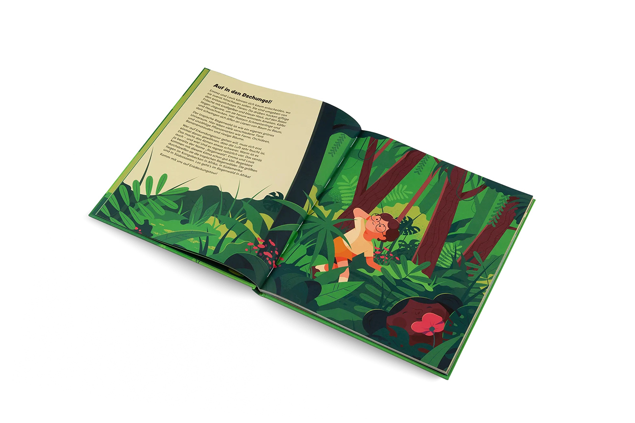 photo of an illustrated book showing a boy in the rainforest 