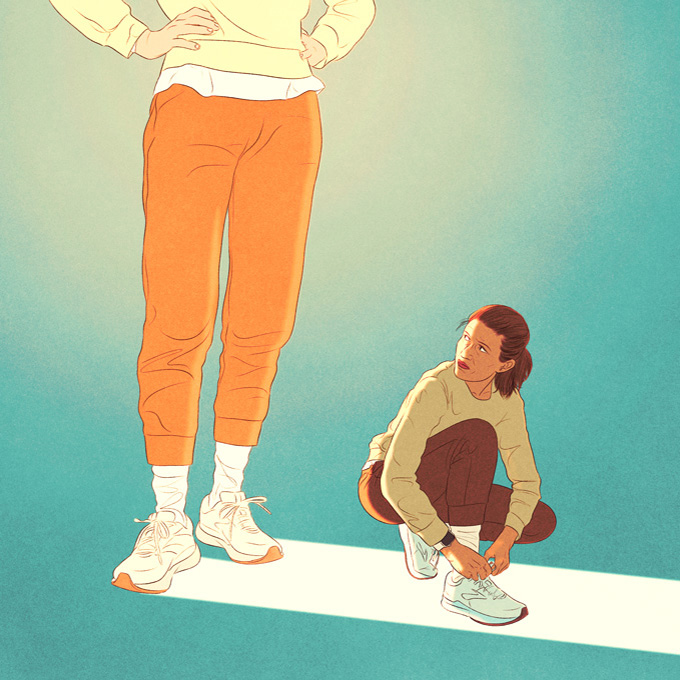 woman kneeling next to a very tall woman 