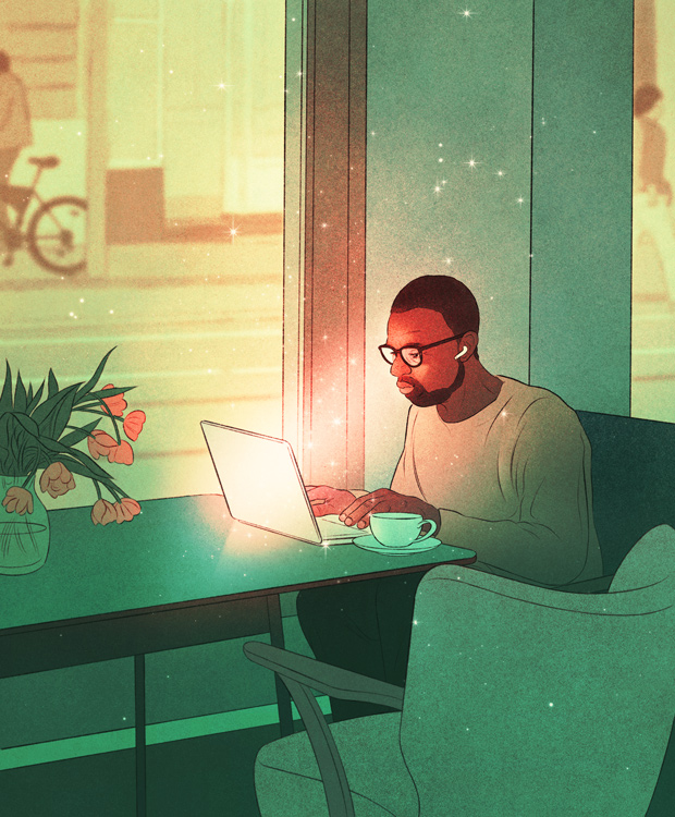 young man working at laptop on cafe 